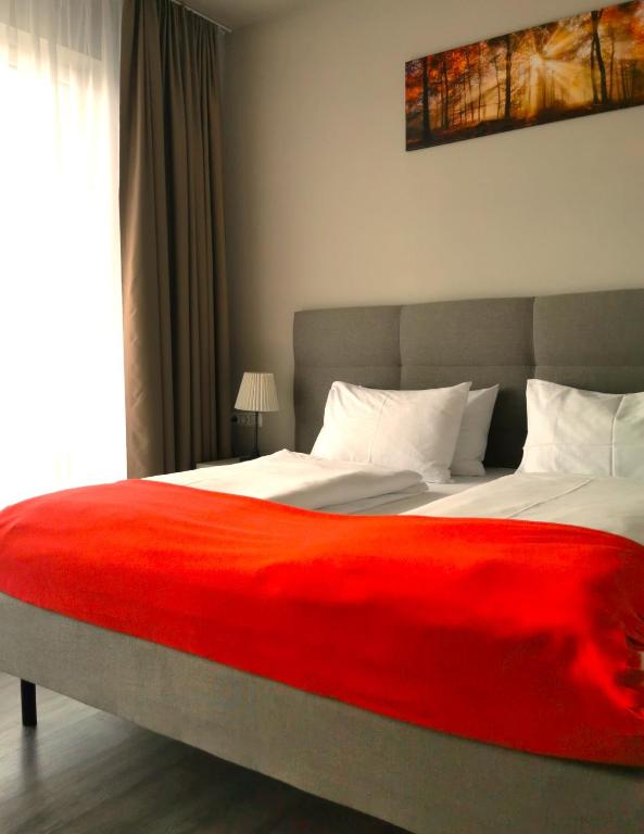 Postel nebo postele na pokoji v ubytování Hotel Gutsmühle