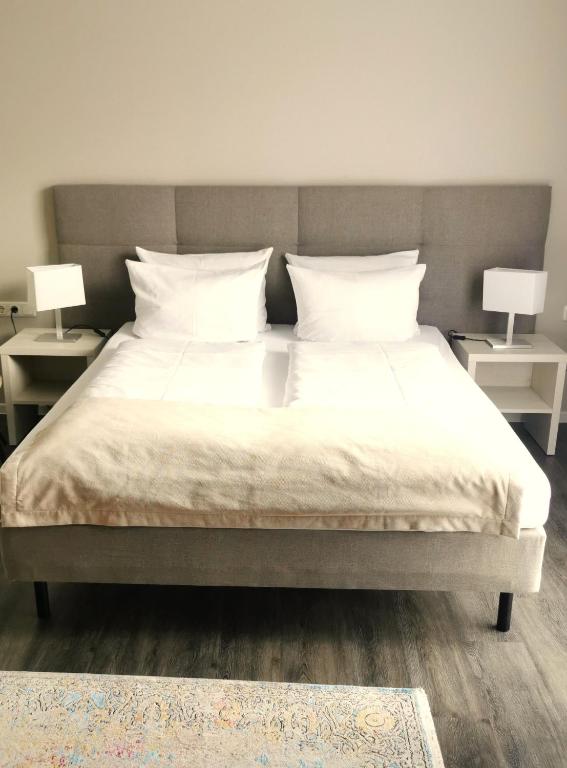 Postel nebo postele na pokoji v ubytování Hotel Gutsmühle