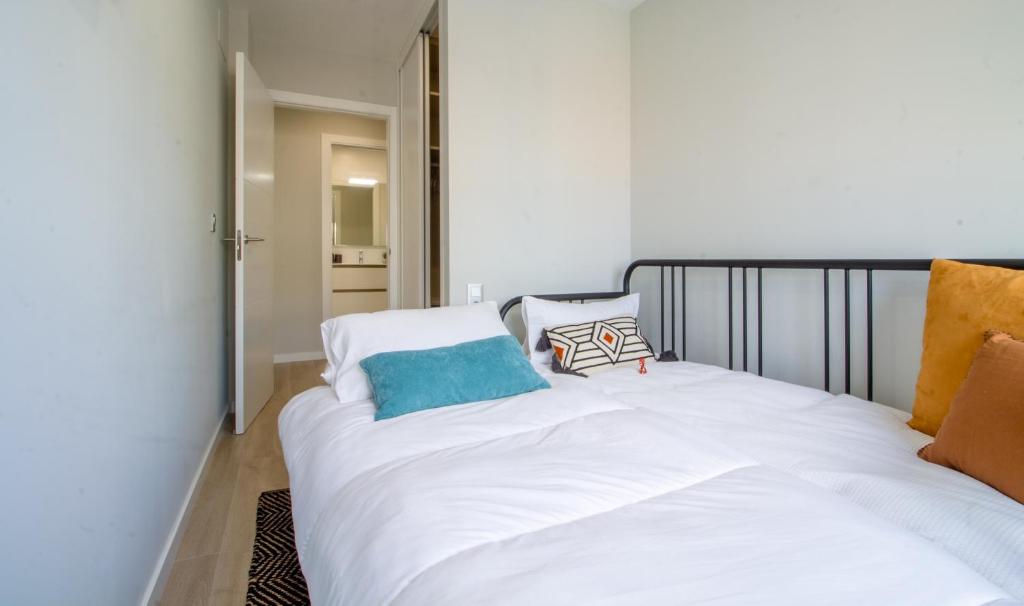 A bed or beds in a room at Moderno, Castro, Corazón de Vigo