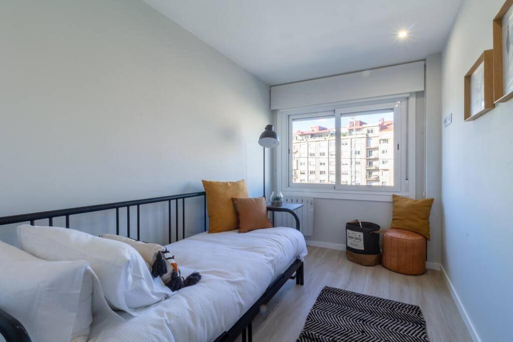 A bed or beds in a room at Moderno, Castro, Corazón de Vigo