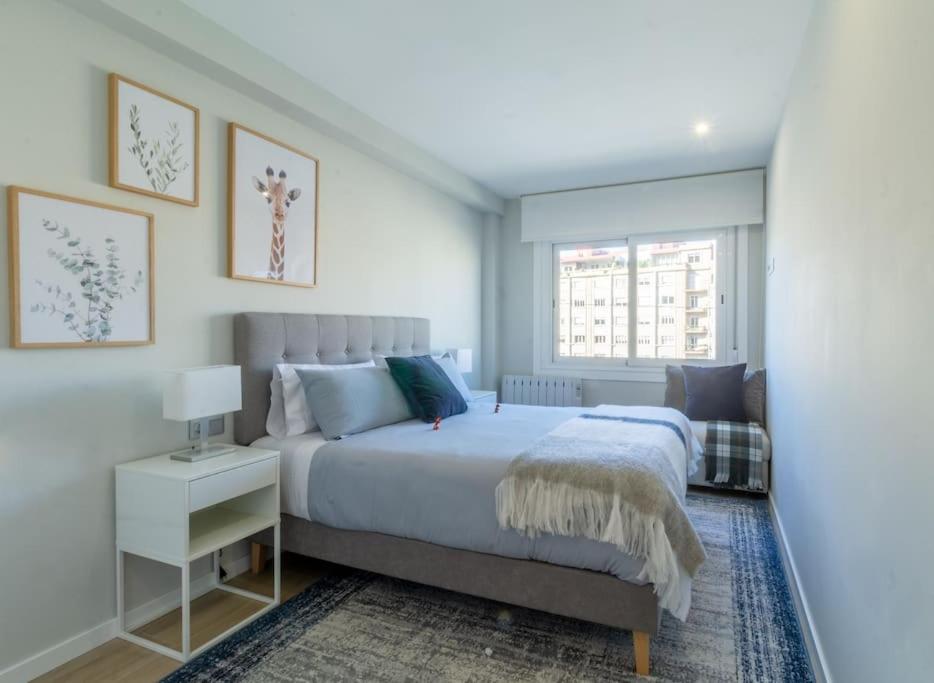 A bed or beds in a room at Moderno, Castro, Corazón de Vigo
