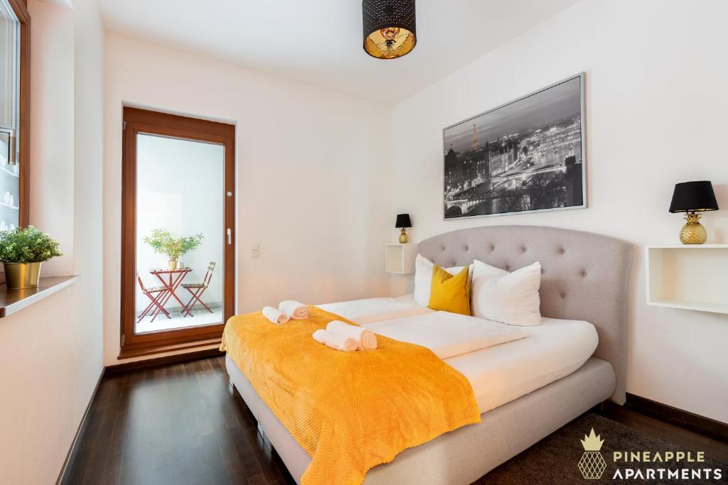 a bedroom with a bed with two stuffed animals on it at Pineapple Apartments Palais am Neumarkt - 90 qm - 1x free parking in Dresden