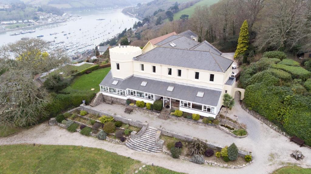 an aerial view of a large white house at Kingswear Park Club in Kingswear