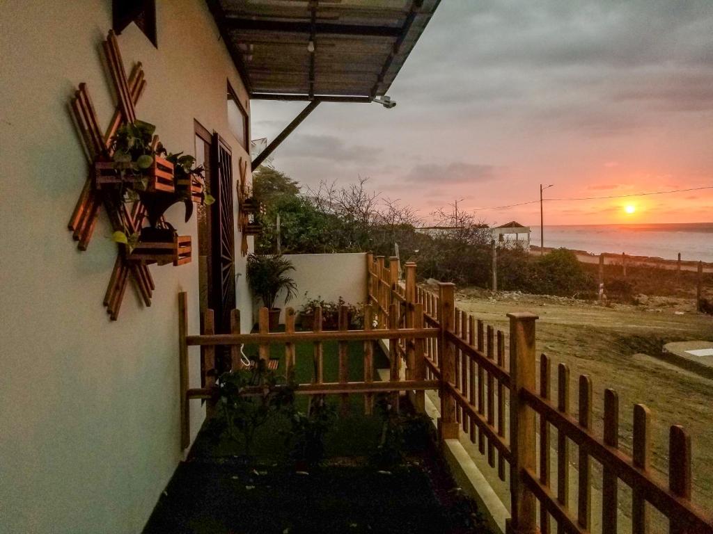 a view of the ocean from a house with a fence at SUITES BRISAMAR PLAYA SANTA MARIANITA Manta in Manta