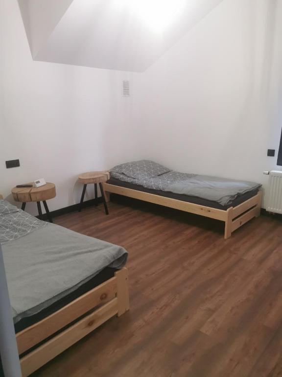 Postel nebo postele na pokoji v ubytování Stalowy Gościniec