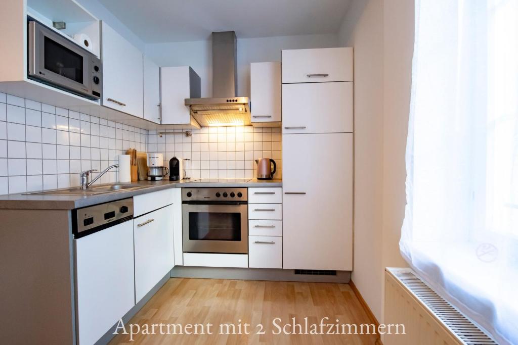 Kuchyň nebo kuchyňský kout v ubytování Astoria Apartments