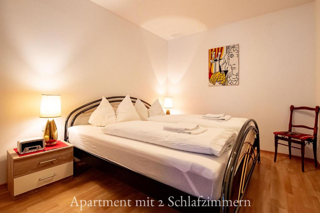 Postel nebo postele na pokoji v ubytování Astoria Apartments
