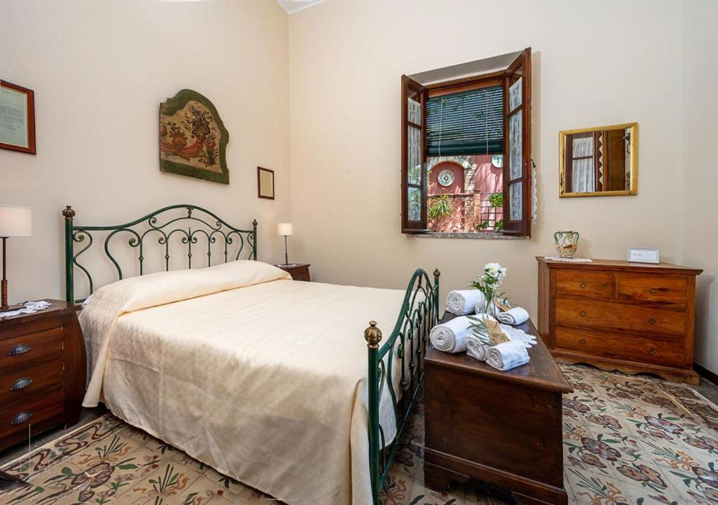 Łóżko lub łóżka w pokoju w obiekcie B&B Villa Vittoria