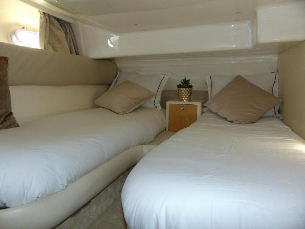 two beds in the back of a boat at Payva & Branco Boats Iate privado em Cascais in Cascais