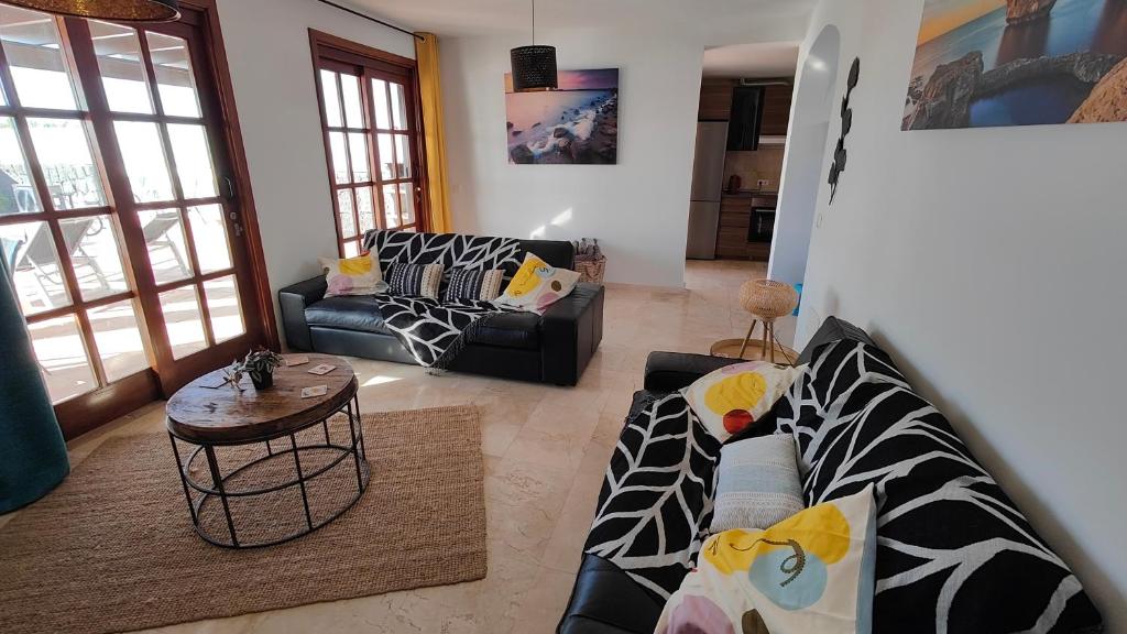 A seating area at Casa del Sol Naciente - heated pools - wifi - UK,BE,NL,FR TV channels