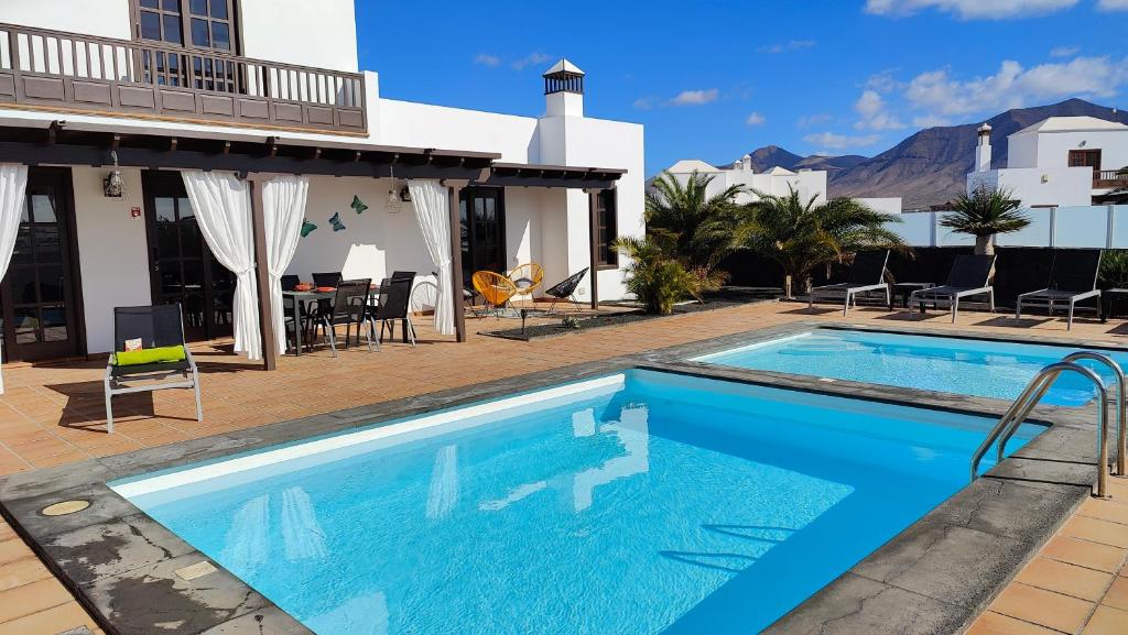 The swimming pool at or close to Casa del Sol Naciente - heated pools - wifi - UK,BE,NL,FR TV channels