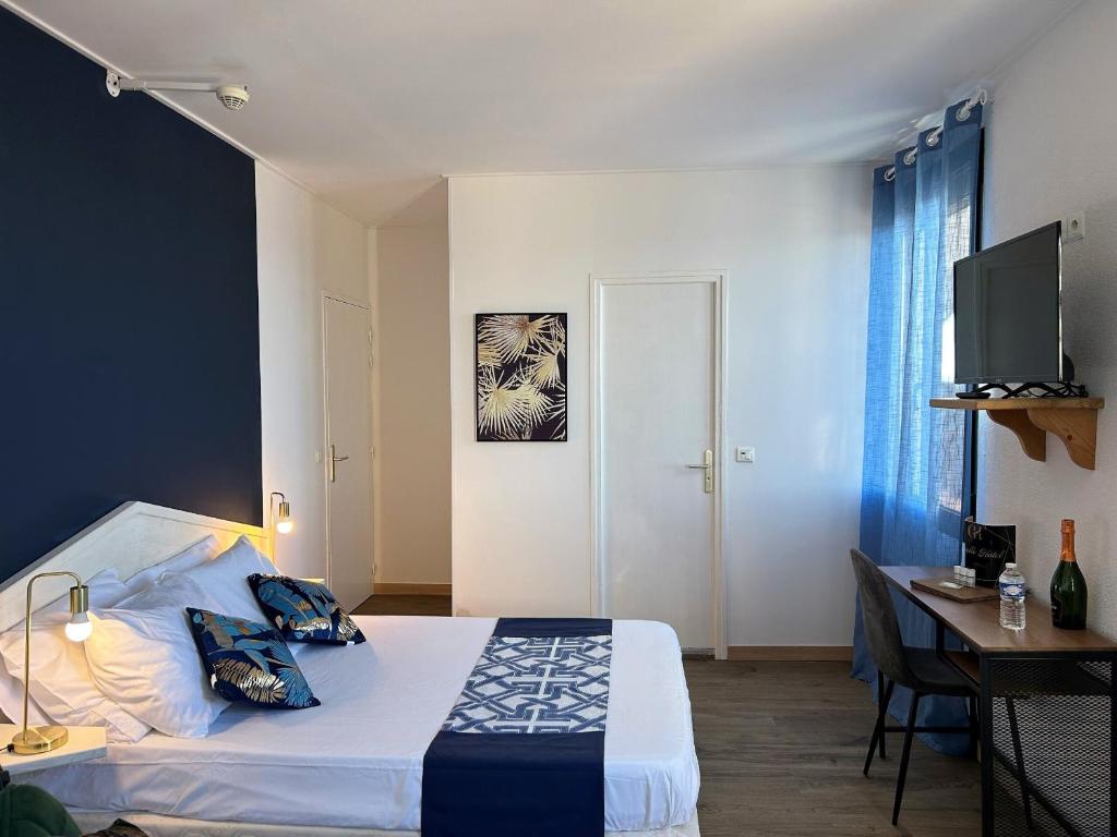 Postel nebo postele na pokoji v ubytování Gabrielle hôtel