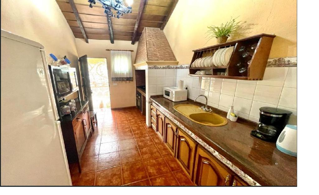Kuchyň nebo kuchyňský kout v ubytování Casa Rural Finca Paraíso. Heated pool