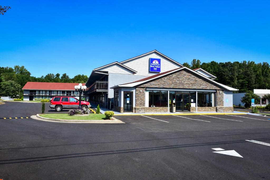 a parking lot in front of a hotel at Americas Best Value Inn Douglasville in Douglasville
