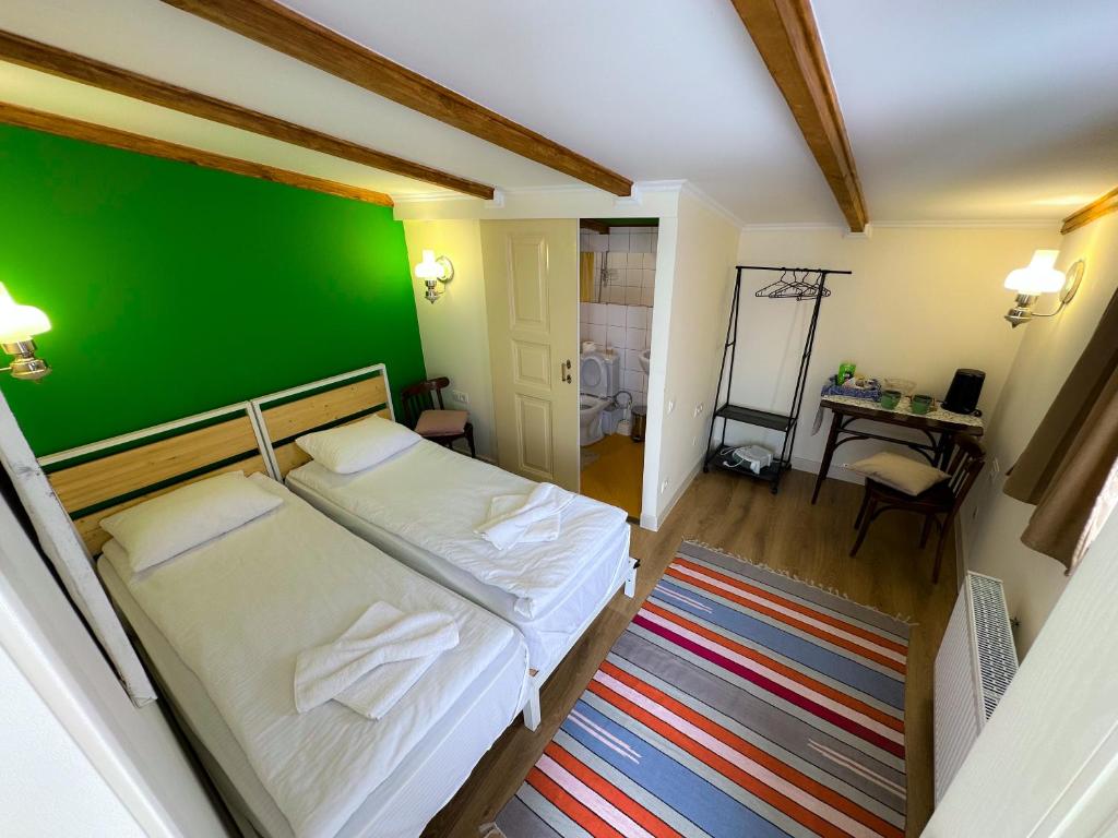 Postel nebo postele na pokoji v ubytování Communa Guesthouse