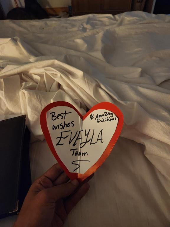 Postel nebo postele na pokoji v ubytování Eveylaa Guesthouse