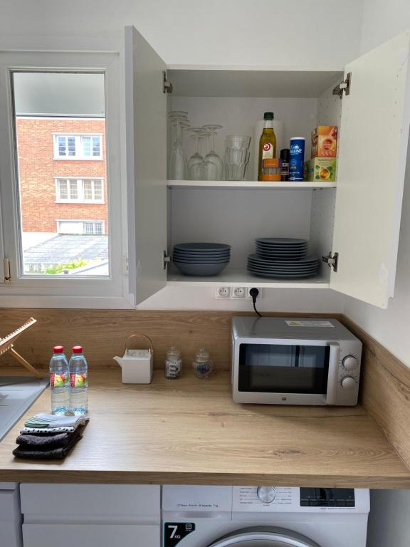 Kuchyňa alebo kuchynka v ubytovaní Chez Mathilde Appartement Calais Nord Citadelle