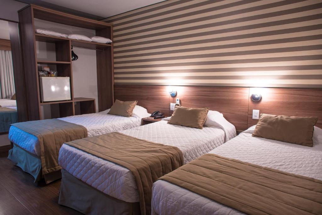 Postel nebo postele na pokoji v ubytování Hotel Continental Business - 200 metros do Complexo Hospitalar Santa Casa
