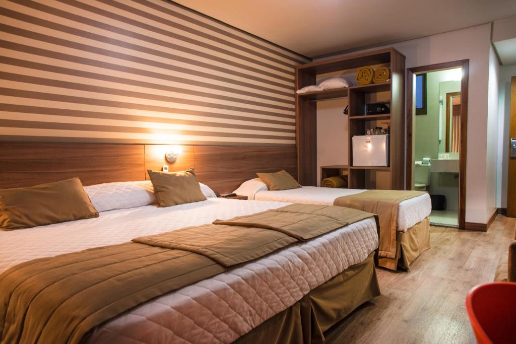 Katil atau katil-katil dalam bilik di Hotel Continental Business - 200 metros do Complexo Hospitalar Santa Casa