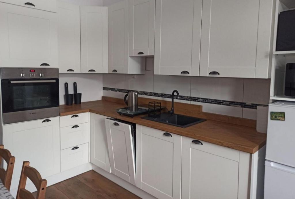 Kuchyňa alebo kuchynka v ubytovaní Apartament Stara Tkalnia