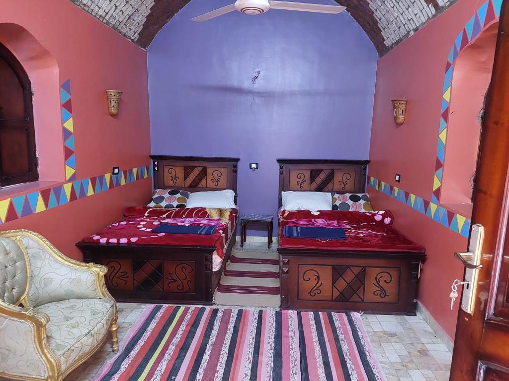 Postel nebo postele na pokoji v ubytování Mostafa guesthouse