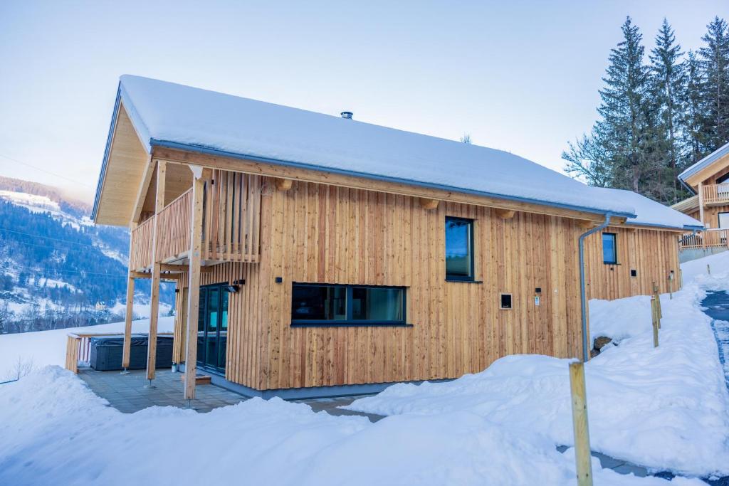 a wooden house in the snow in the snow at Chalet Bavaria in Sankt Lorenzen ob Murau