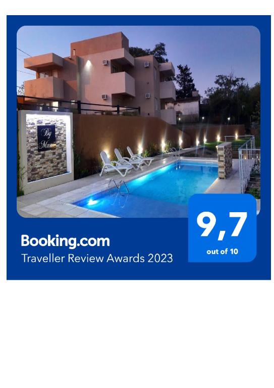 a villa with a swimming pool at night at By Muni Apartamentos Premium in Tanti