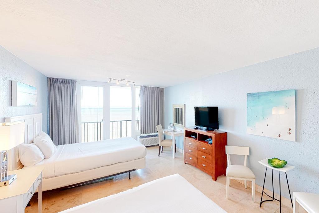 a hotel room with a bed and a tv at Bayside at Sandestin #6580 in Destin
