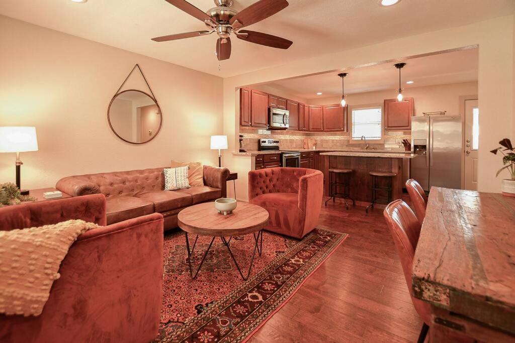 a living room with a couch and a table at Old Town Bungalow - 4 blocks to Historic Square in Georgetown