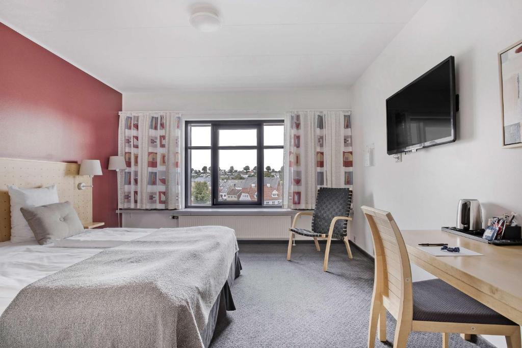 Postel nebo postele na pokoji v ubytování Hotel Svendborg
