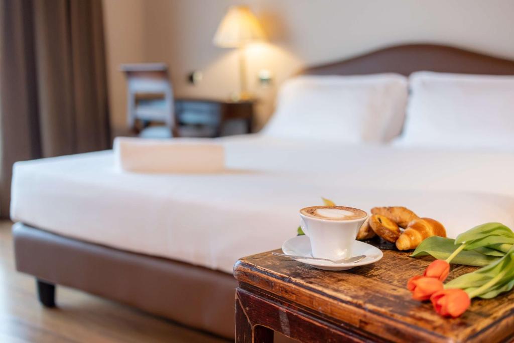Łóżko lub łóżka w pokoju w obiekcie Hotel Horizon Wellness & Spa Resort - Best Western Signature Collection
