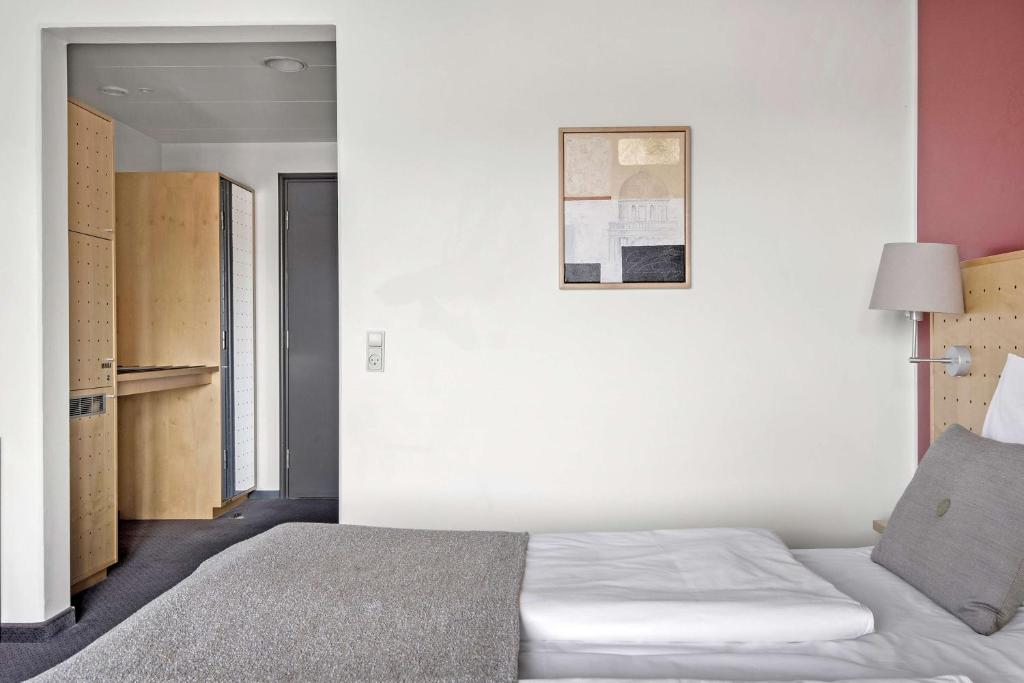 Postel nebo postele na pokoji v ubytování Hotel Svendborg