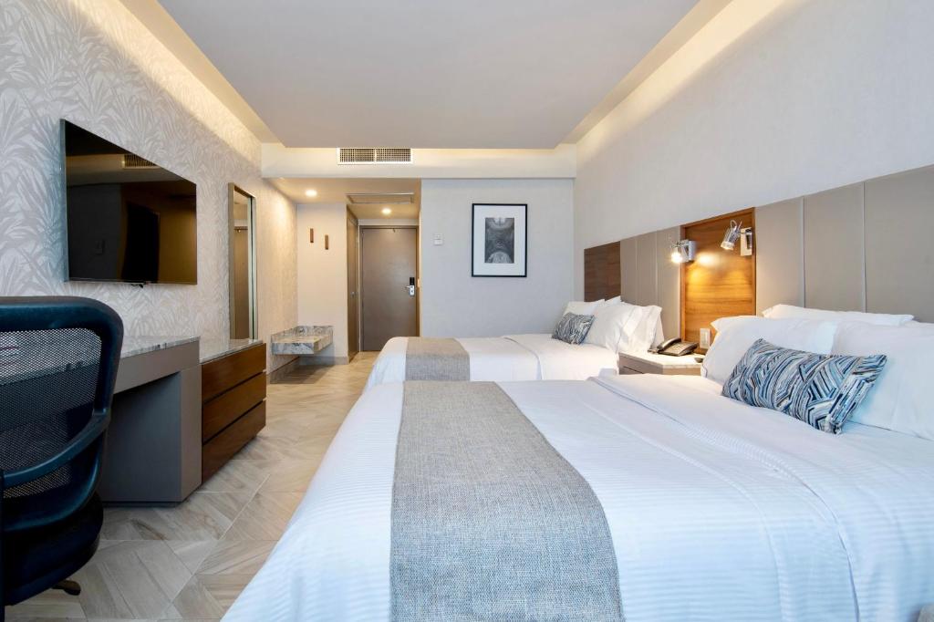 Postel nebo postele na pokoji v ubytování Hotel Plaza Diana