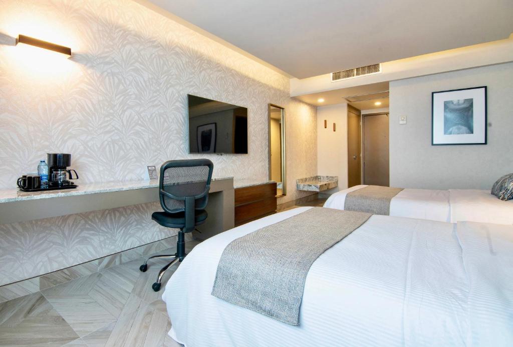 TV a/nebo společenská místnost v ubytování Hotel Plaza Diana