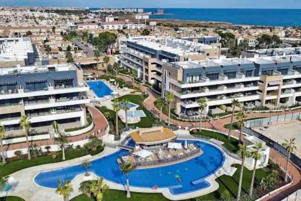 an aerial view of a resort with a pool at Penthouse 2-Rooms with Private Jacuzzi in the Solarium in Orihuela Costa