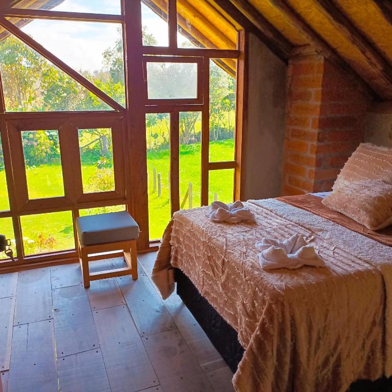 Voodi või voodid majutusasutuse Chalet del lago Santa Elena toas