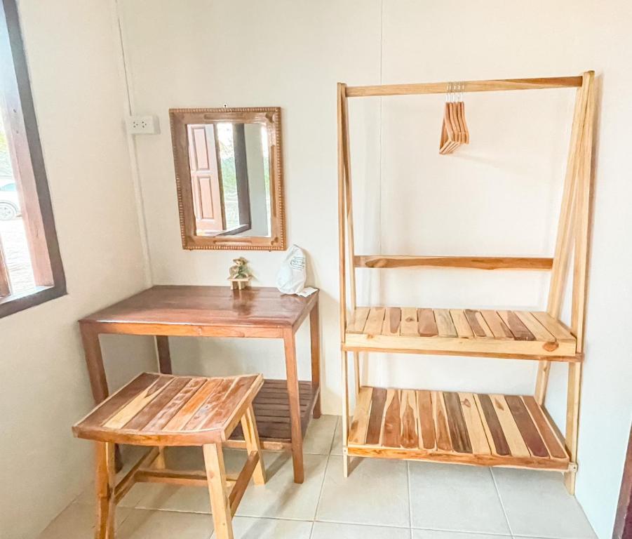 Postel nebo postele na pokoji v ubytování เชียงคานพาราไดร์รีสอร์ท&มีตติ้ง