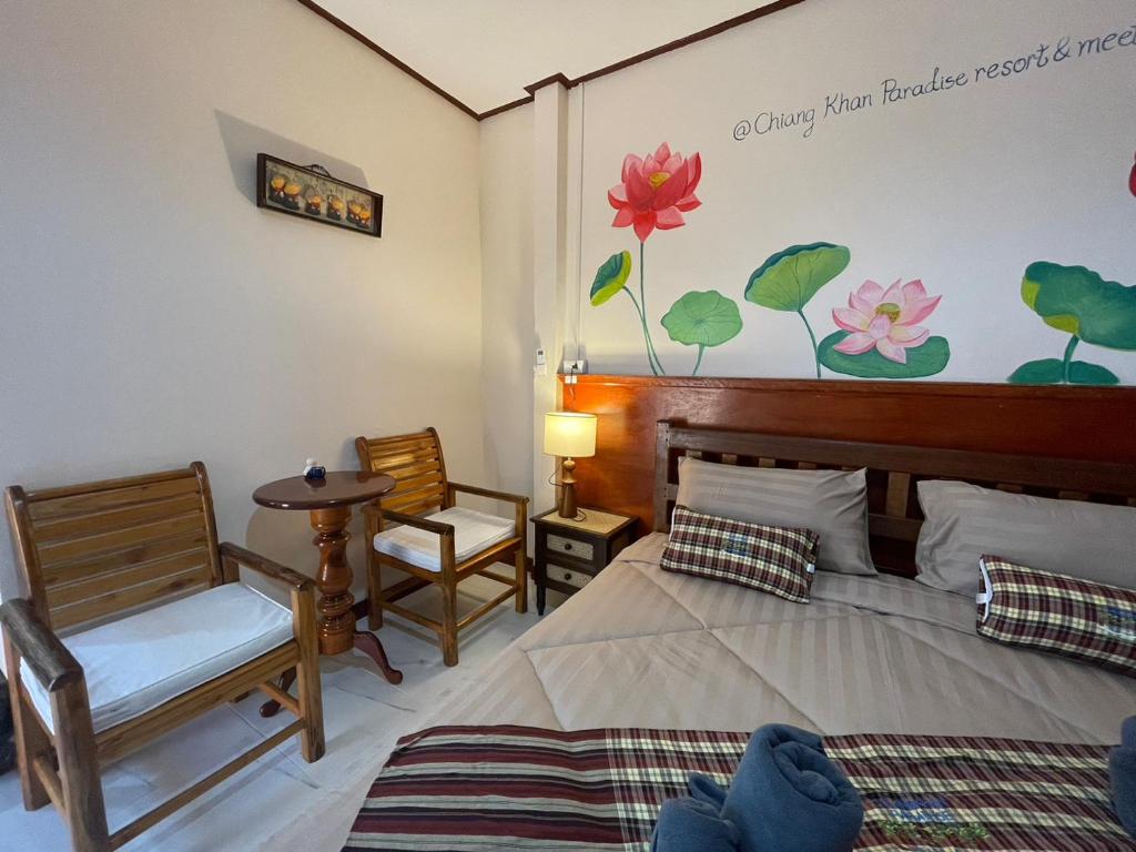 Postel nebo postele na pokoji v ubytování เชียงคานพาราไดร์รีสอร์ท&มีตติ้ง