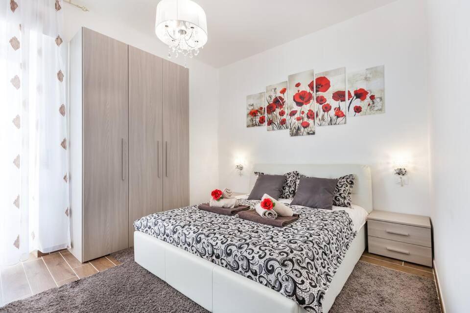 Ένα ή περισσότερα κρεβάτια σε δωμάτιο στο Residenza Alexander Luxury 1