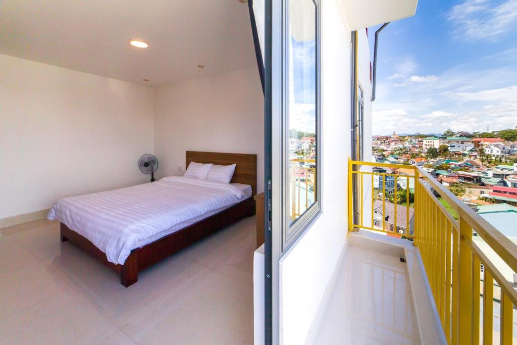 Giường trong phòng chung tại Đà Lạt Cao Nguyên Hotel