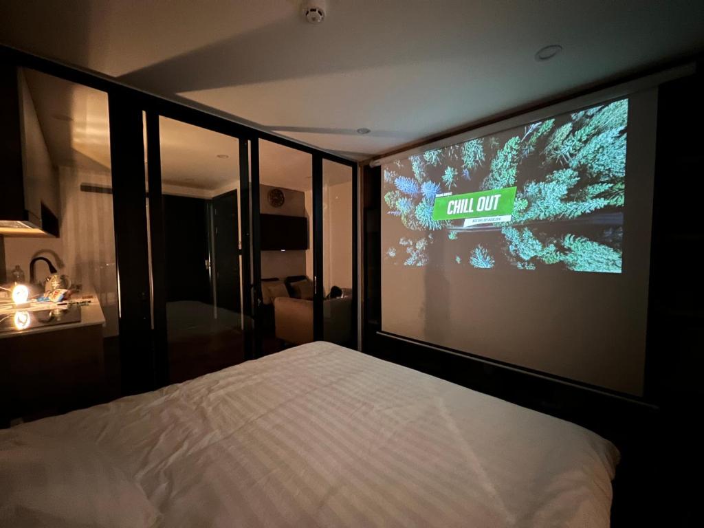 Giường trong phòng chung tại LE CIMENT - Apartment Hotel