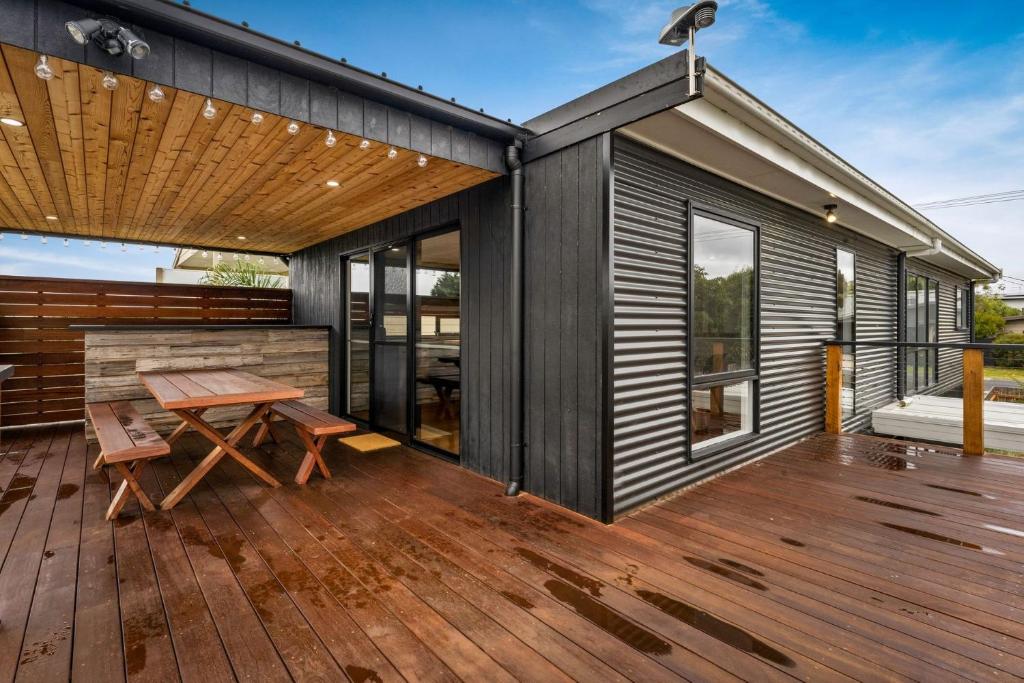 a wooden deck with a picnic table on a house at The Bight Cape Woolamai in Cape Woolamai