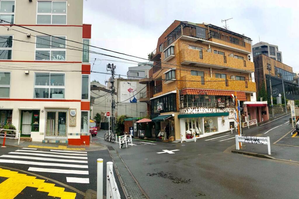 a city street with a building and a crosswalk at Daikanyama 42 VALUE ADD Apartments in Tokyo