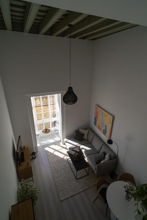 Posezení v ubytování Apartamento Duplex casa Palacio rehabilitado centro El Puerto