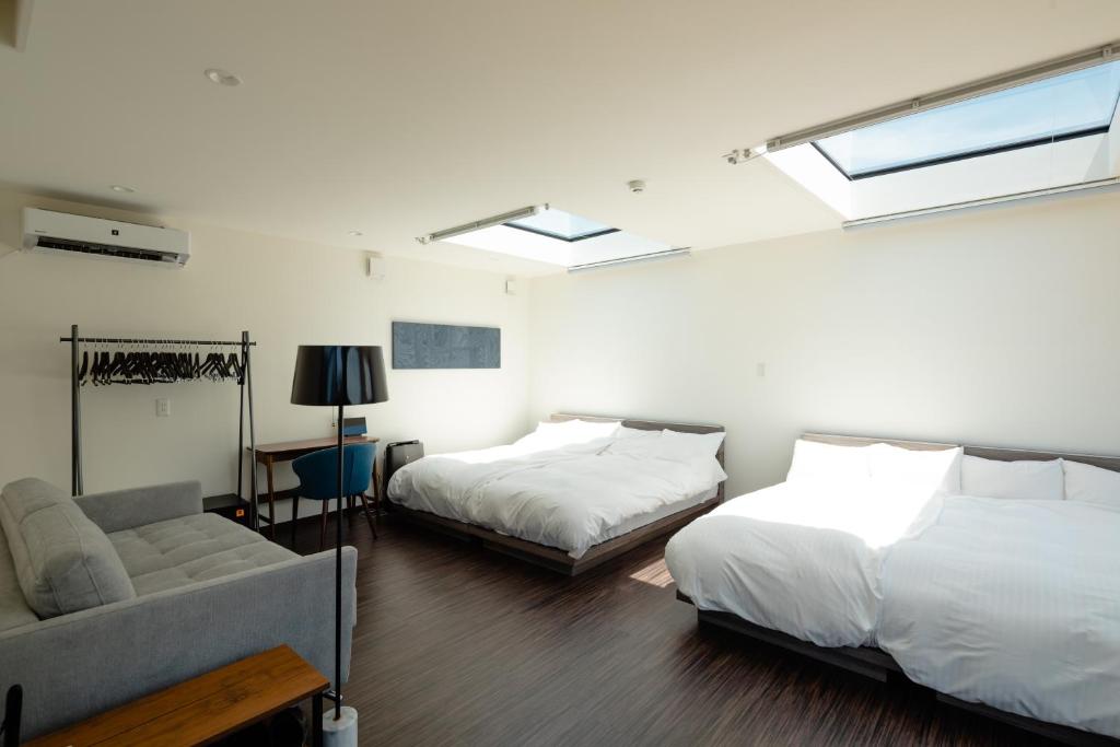 Postel nebo postele na pokoji v ubytování ISUMI Glamping Resort ＆Spa SOLAS