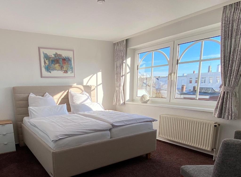 Postel nebo postele na pokoji v ubytování Strandvilla an der Kaiserwiese