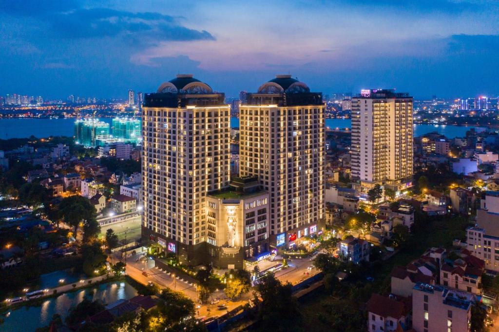 a city skyline at night with tall buildings at D'LEROI SOLEIL- TAY HO- NEAR WESTLAKE IN HA Noi in Hanoi