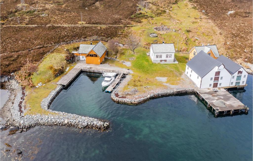 an aerial view of a house on an island in the water at Nice Home In Kvamsy With Kitchen in Sandvik