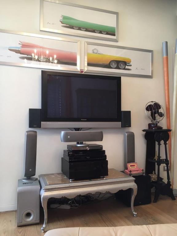 A television and/or entertainment centre at Appartamento Fronte Mare