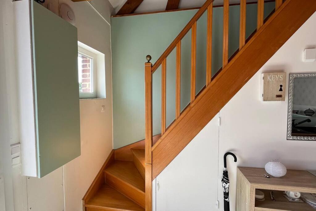 a staircase in a home with wooden floors at La Reinette du Verger 9 d&#39;Arry 1 in Arry